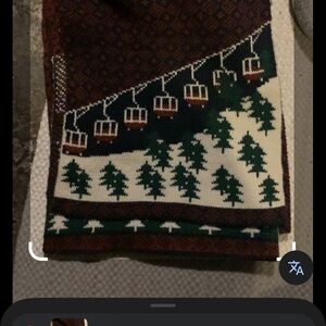 21 Men knit scarf featuring a distinct winter or ski-themed pattern